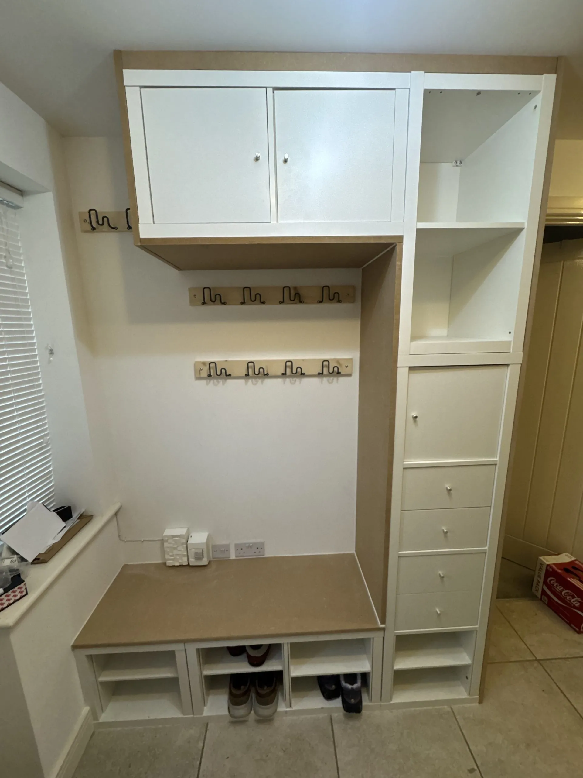 Completed built-in boot room and cloakroom with hanging space and fitted shelving