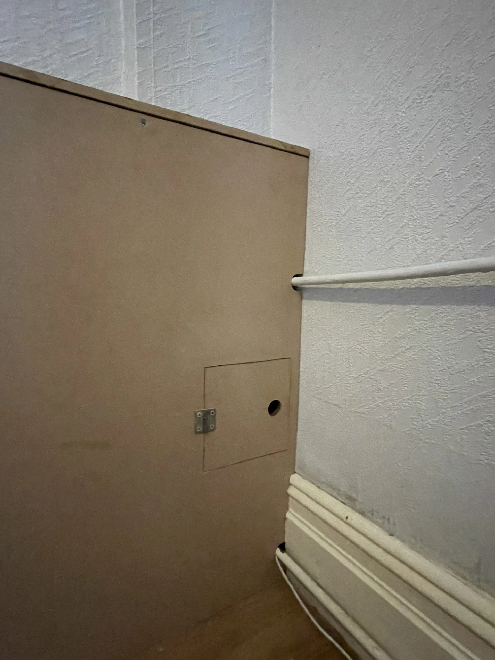 Cabling run into the wall for the headboard's integrated lighting