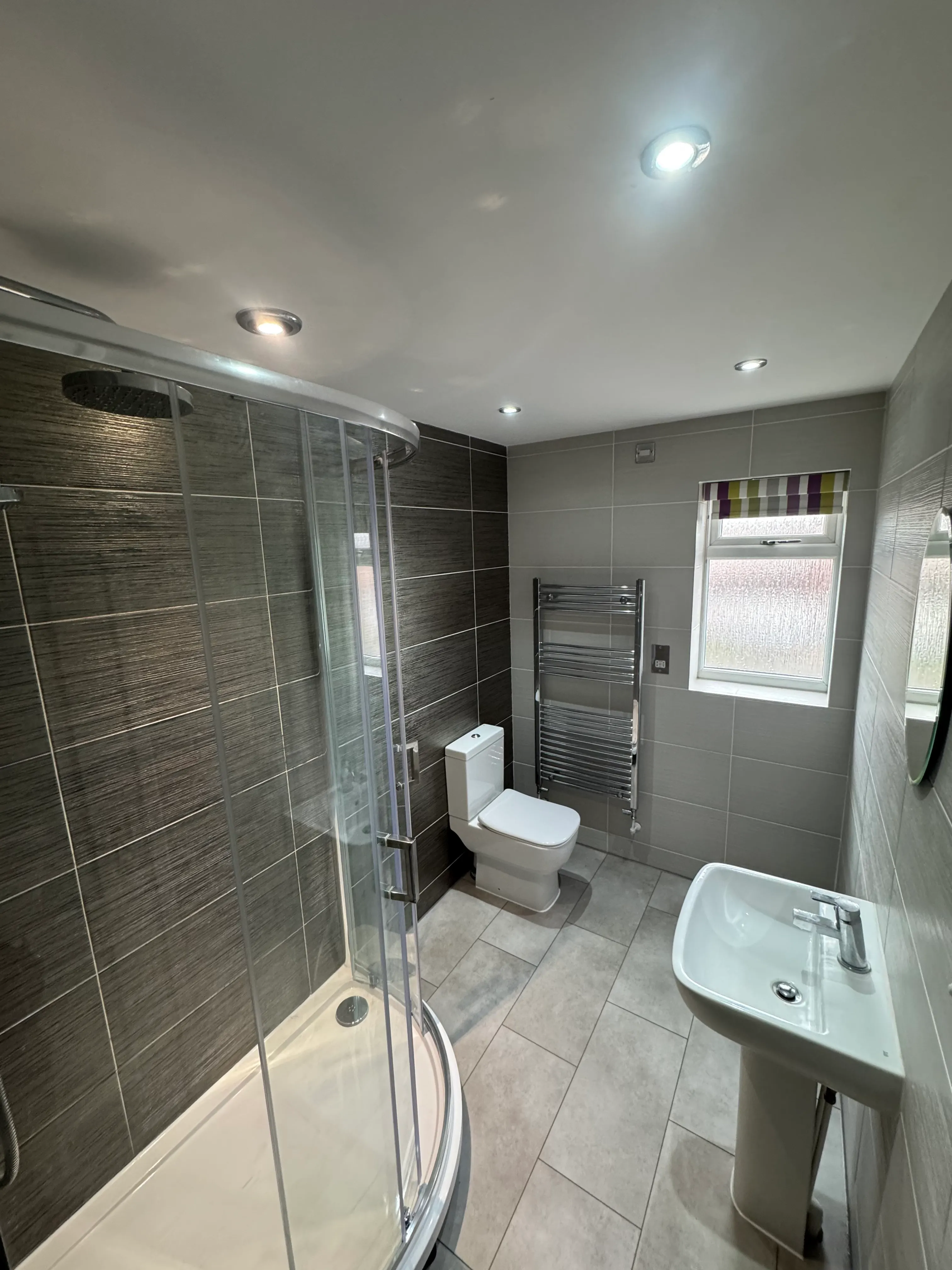 Bathroom being refitted, with tiling under way