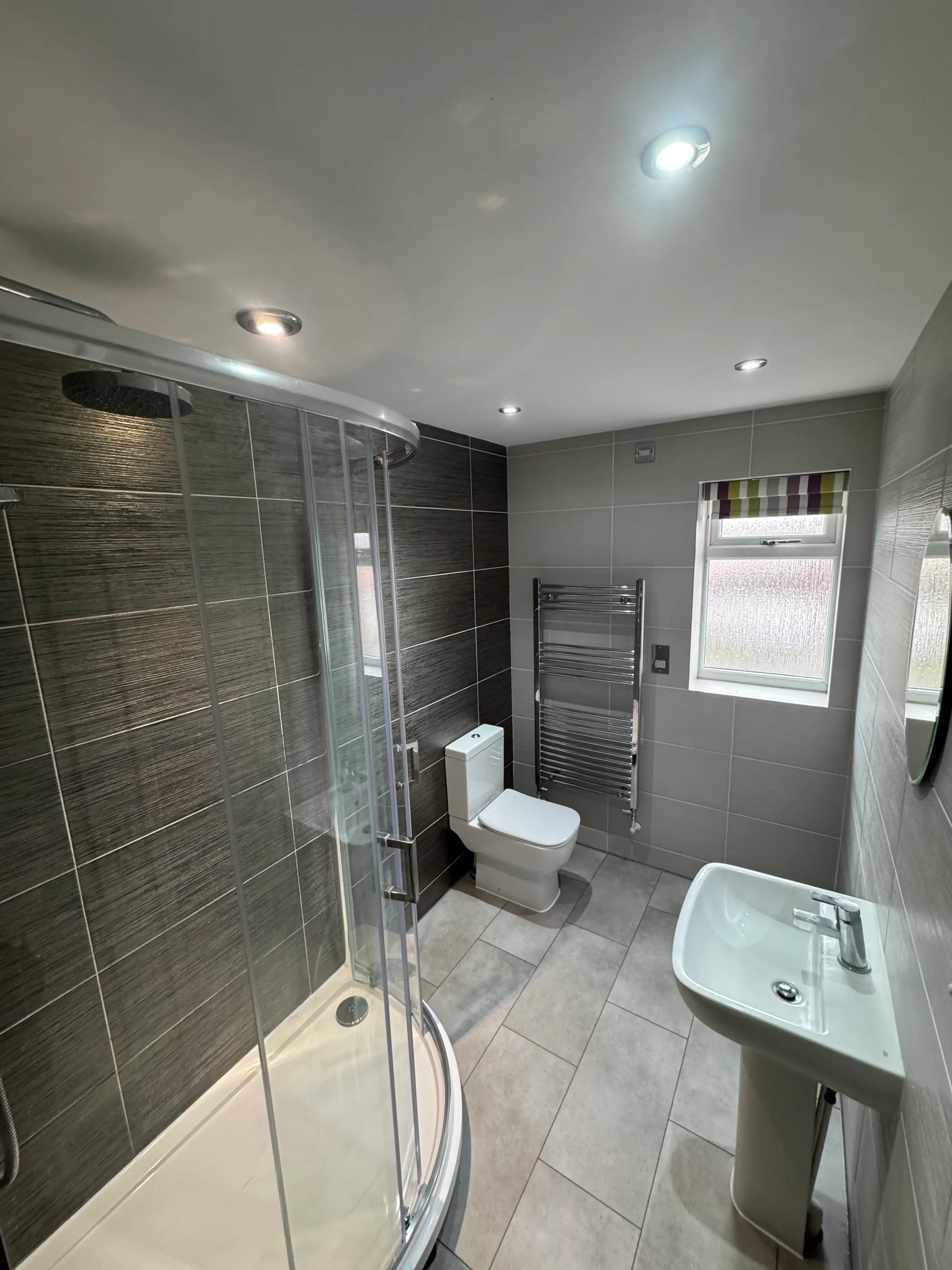 Bathroom being refitted, with tiling under way