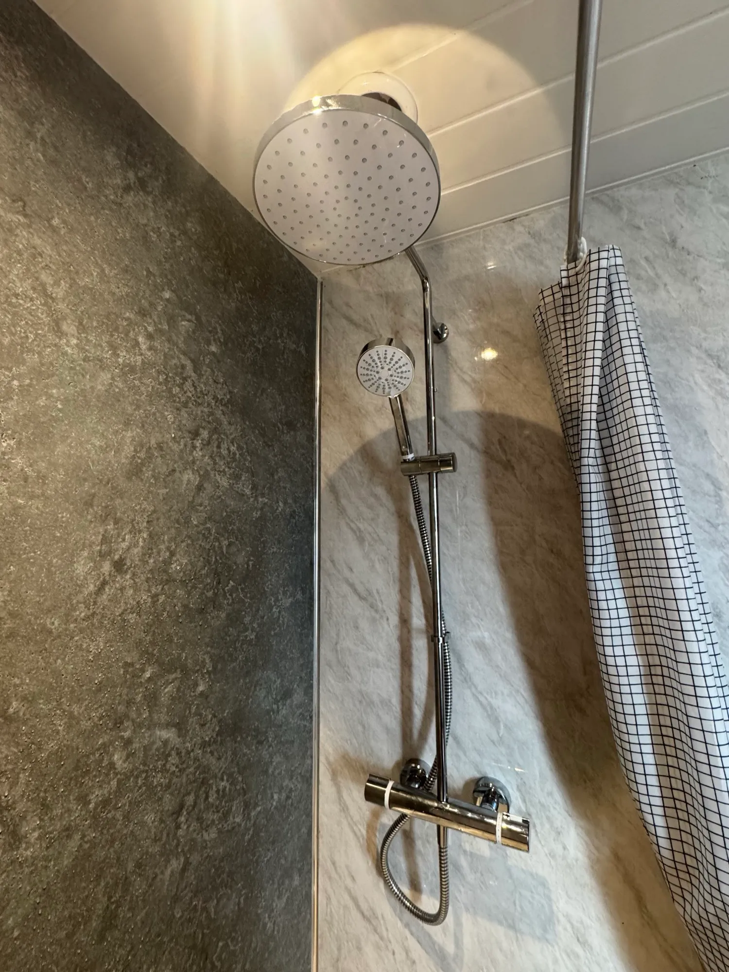 Mira Atom electric shower fitted to a tiled wall, replaced the same day