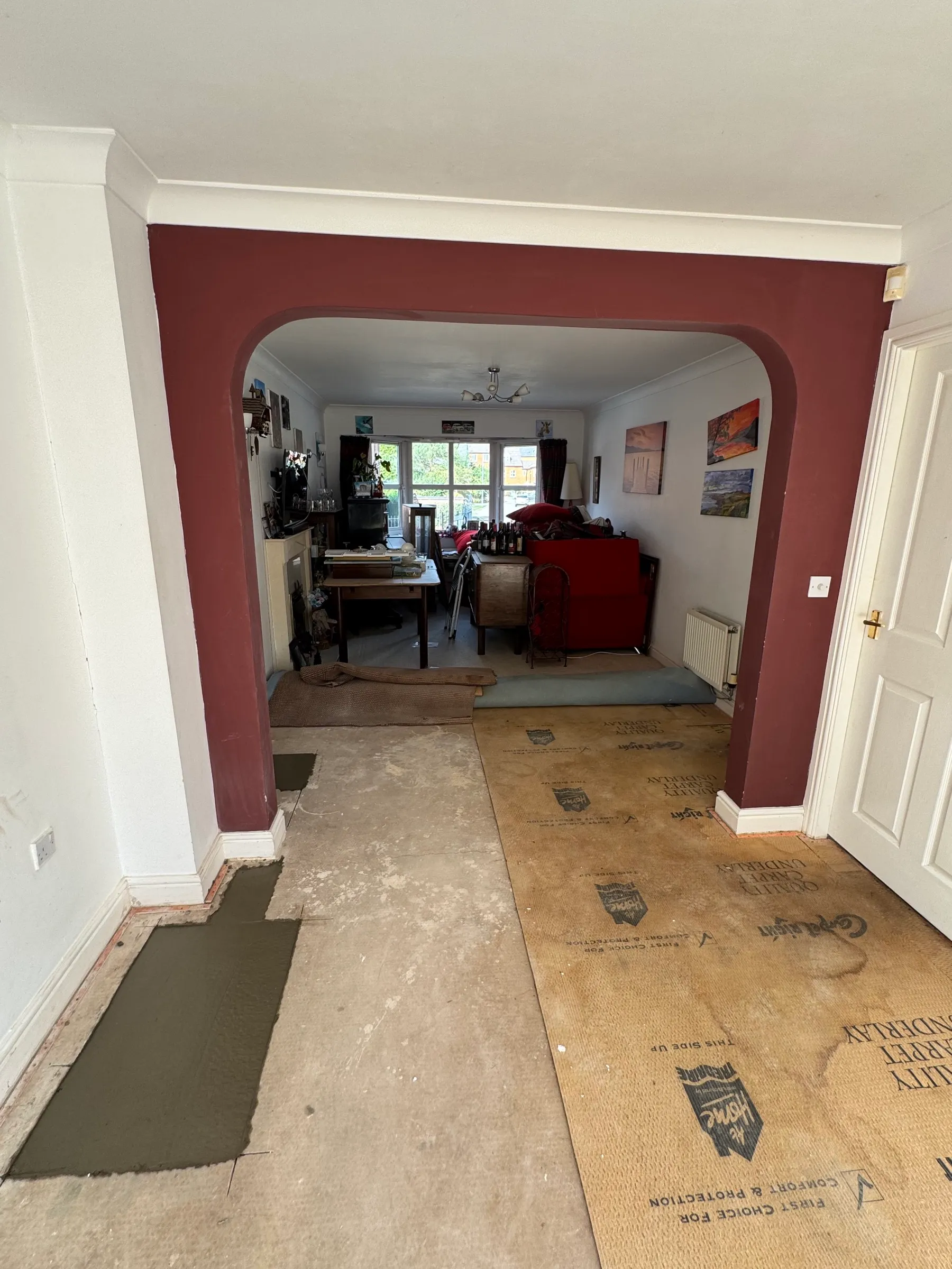 The living room floor with the concrete slab re-poured and the room put back